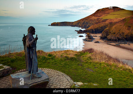 Statue of St Carannog  by artist Sebastien Boyesen overlooking Llangrannog beach, Ceredigion, West Wales. Stock Photo