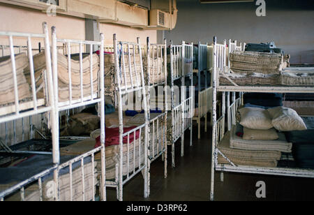 Empty beds in the detention camp Omarska, Bosnia and Herzegovina Stock Photo