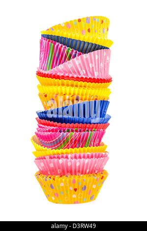 Stacked colorful muffin cups isolated on white background Stock Photo