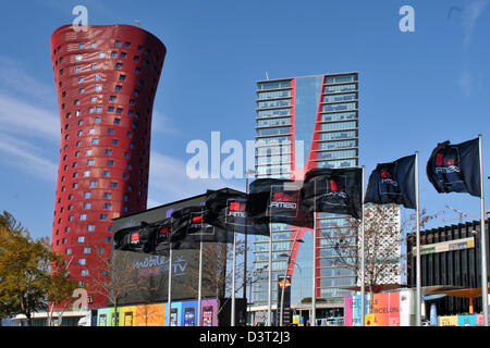 Flags of the organizer GSMA wave on the premises of the Mobile World Congress in Barcelona, Spain, 24 February 2013. The towers in the back were designed by Japanese architect Toyo Ito. Around 1,500 exhibitors show their latest trends at the trade fair, which takes place from 25 until 28 Februayr 2013. Photo: PETER ZSCHUNKE Stock Photo