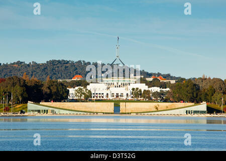 View across Lake Burley Griffin to old and new Parliament House. Canberra, Australian Capital Territory (ACT), Australia Stock Photo