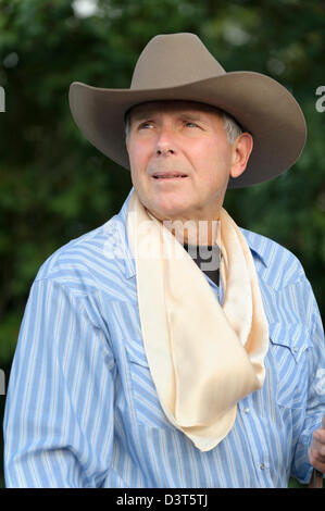 Cowboy head shot with hat and silk kerchief around neck, mature adult and handsome older man. Stock Photo