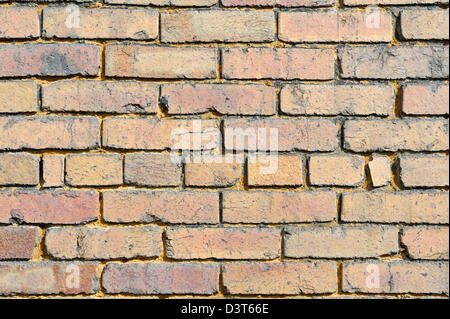 Yellow brick close up for backgrounds and textures, design element, old and weathered with character. Stock Photo