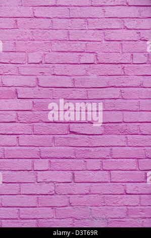 Purple brick wall close up for background uses and textured overlay, design element. Stock Photo