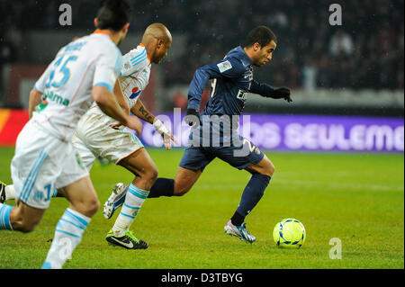 Paris, France. 24th Feb, 2013. . Football (Ligue 1), 26th round, PSG vs OM 2-0. Andre Ayew (OM), Lucas Moura (PSG). Photo Frédéric Augendre Stock Photo