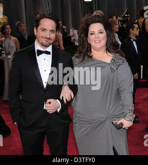 Los Angeles, California, USA. 24th February 2013.  MELISSA MCCARTHY in a David Meister Signature gown and her husband BEN FALCONE arrives on the red carpet for the 85th Academy Awards at the Dolby Theatre. (Credit Image: Credit:  Lisa O'Connor/ZUMAPRESS.com/Alamy Live News) Stock Photo