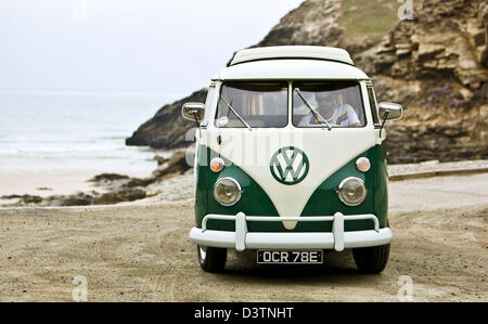 Green VW campervan on beach, St Agnes, Cornwall, UK Stock Photo