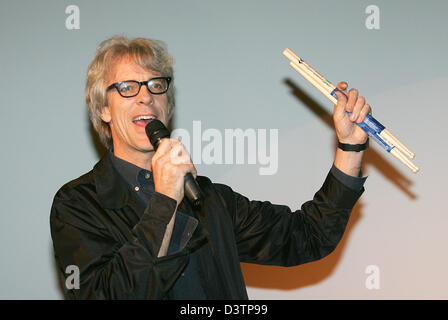 Stewart Copeland, former drummer of legendary rock band 'The Police' throws drum sticks after the premiere of his documentary  'Every One Stares: The Police Inside Out' in Berlin, Germany, 24 October 2006. The documentary shows the band on tour, with fans freaking out, rehearsing and recording in fast pictures and cuts. Copeland did the shooting with an Super 8 camera back in the d Stock Photo