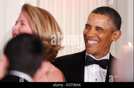 Washington DC, USA. 24th February 2013. United States President Barack Obama laughs during the National Governors Association 2013 Black-tie Dinner in the State Dining Room of the White House in Washington, D.C., February 24, 2013. .Credit: Olivier Douliery / Pool via CNP/dpa/Alamy Live News Stock Photo