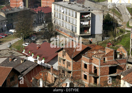 The photo shows a view over Srebrenica with destroyed houses, Bosnia and Herzegovina, 15 November 2006. Srebrenica is located at the border to Serbia. The city's number of inhabitants went down to 21,000, mostly Serbs and Serbian refugees from the Bosnian-Croatian Federation. The city set the sad scene for the massacre in July 1995, when Bosnian Serbs under the commando of General  Stock Photo