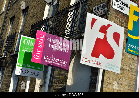 Estate agents' boards outside a property in Camden Town, London, UK Stock Photo