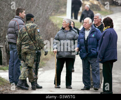 German Bundeswehr soldiers patrol with an interpreter the village ...