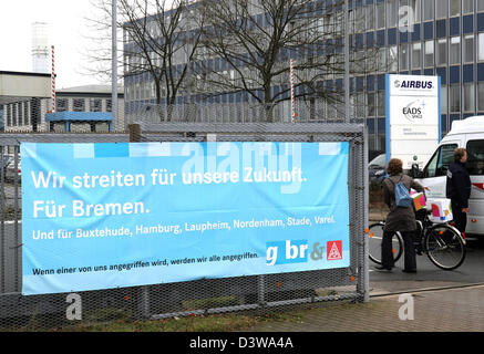 A poster reading 'We fight for our future. For Bremen. And for Buxtehude, Hamburg, Laupheim, Nordenham, Stade and Varel' photographed in front of the main entrance to the Airbus factory in Bremen, Germany, Thursday 01 February 2007. Restructuring measures threaten the reduction of thousands of jobs in the factories in Northern Germany. Protest organised by employees and Germany's d Stock Photo