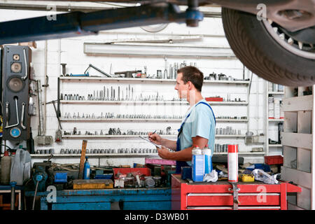 Small business practice of car garage repair shop Stock Photo