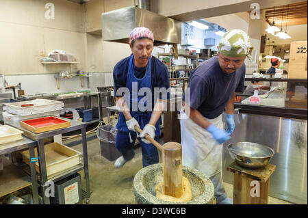 Men working at Nishiki food market, Kyoto, Japan, Asia Stock Photo