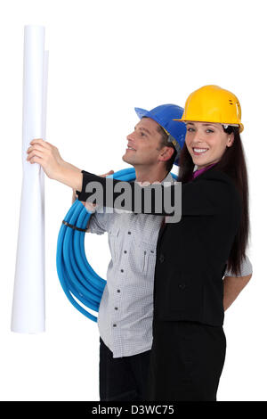 Male and female builders Stock Photo