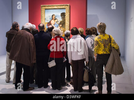 A crowd of people view Leonardo da Vinci's The Virgin and Child with St. Anne at Louvre-Lens Stock Photo