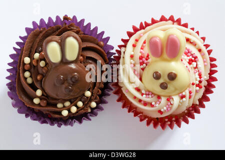 Easter cupcakes with white and milk chocolate bunny rabbits on isolated on white background Stock Photo