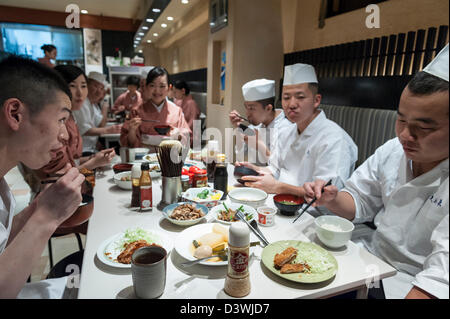 Restaurant workers having a lunch break, Tokyo, Japan, Asia Stock Photo