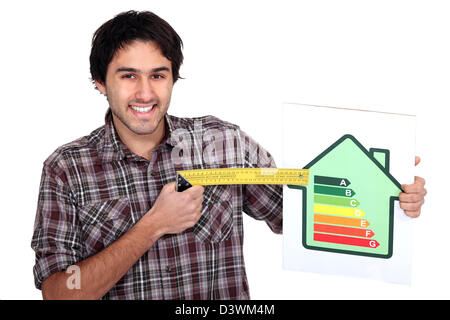 Man with an energy rating sign Stock Photo