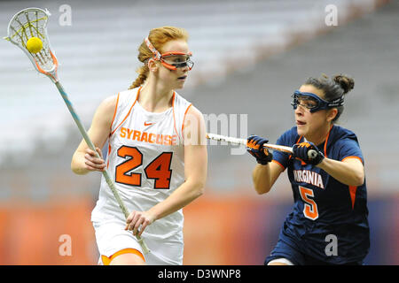 Feb. 24, 2013 - Syracuse, New York, U.S - February 24, 2013: Syracuse Orange midfielder Bridget Daley #24 drives to the goal around Virginia Cavaliers defender Megan Dunleavy #5 during the second half of an NCAA Women's Lacrosse game between the Virginia Cavaliers and the Syracuse Orange at the Carrier Dome in Syracuse, New York. Syracuse defeated Virginia 10-9. Stock Photo