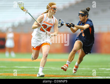 Feb. 24, 2013 - Syracuse, New York, U.S - February 24, 2013: Syracuse Orange midfielder Bridget Daley #24 drives to the goal around Virginia Cavaliers defender Megan Dunleavy #5 during the second half of an NCAA Women's Lacrosse game between the Virginia Cavaliers and the Syracuse Orange at the Carrier Dome in Syracuse, New York. Syracuse defeated Virginia 10-9. Stock Photo