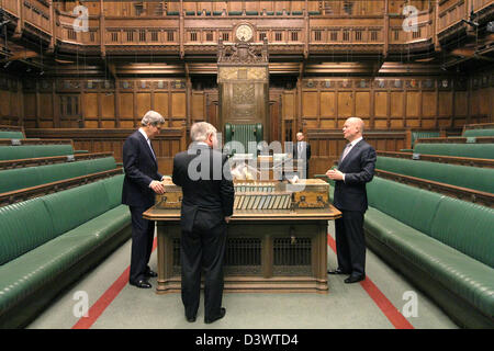 US Secretary of State John Kerry with House of Commons Speaker John Bercow (center) and UK Foreign Secretary William Hague (right) visit the chamber of the House of Commons in London February 25, 2013. Kerry is on an 11-day trip, his first as secretary of state stopping in London before heading to Berlin, Paris, Rome, Ankara, Cairo, Riyadh, Abu Dhabi and Doha. Stock Photo