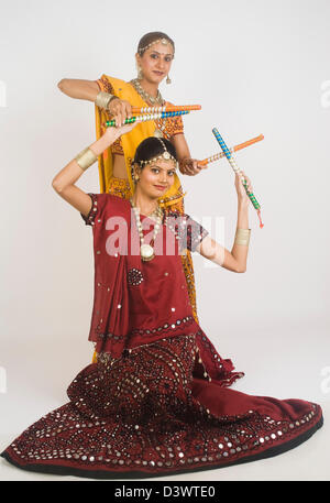 Women performing dandiya Stock Photo - Alamy