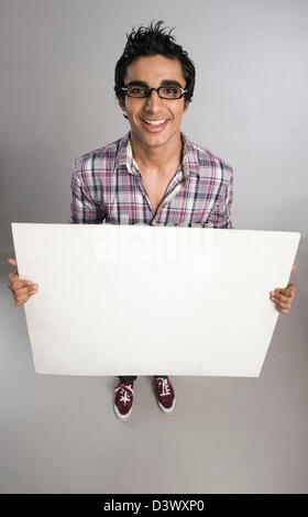 Man standing with a placard Stock Photo