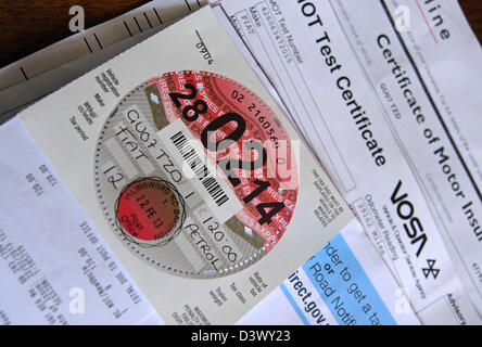 New car road tax disc for 2013 with MOT and insurance certificate UK Stock Photo