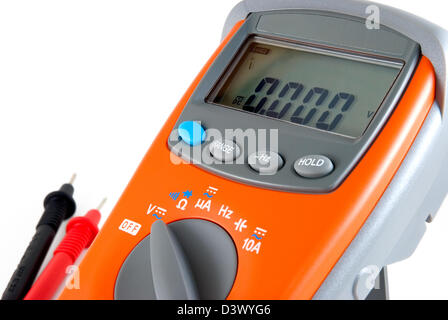 The orange multimeter is photographed on a white background Stock Photo