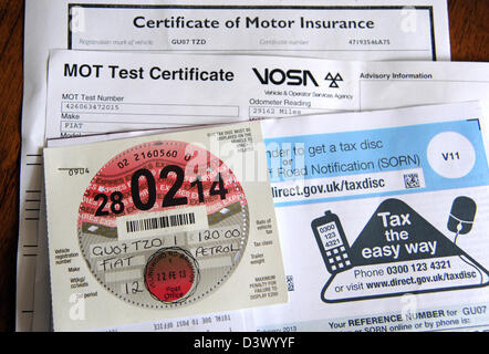 New car road tax disc for 2013 with MOT and insurance certificate UK Stock Photo