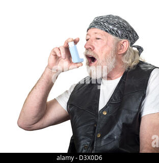 Strong mature man using an inhalor isolated on white Stock Photo