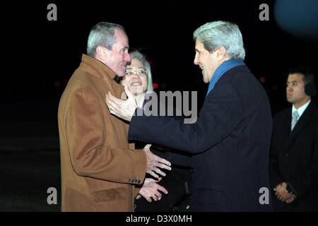 US Secretary of State John Kerry is greeted by Ambassador to Germany Philip Murphy and German Head of Protocol Claudia Schmitz upon arriving at Tegel Airport. Kerry is on an 11-day trip, his first as secretary of state stopping in London, Berlin, Paris, Rome, Ankara, Cairo, Riyadh, Abu Dhabi and Doha. Stock Photo