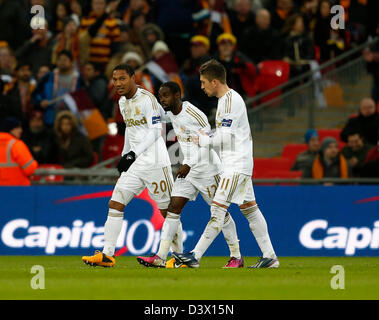 London, UK. 24th February 2013.  Swansea's Nathan Dyer argues with Jonathan De Guzman make up to celebrate thir sides fourth goal..Bradford City v Swansea City- Capital One Cup Final - Wembley Stadium, London- 24/02/13 - Picture David Klein/Sportimage/Alamy Live News Stock Photo