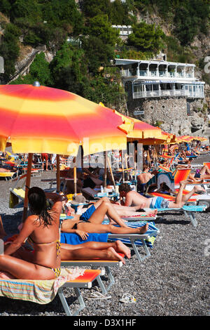 Tourists on the beach, Amalfi, Province Of Salerno, Gulf Of Salerno, Tyrrhenian Sea, Campania, Italy Stock Photo