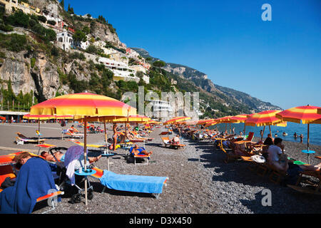 Tourists on the beach, Amalfi, Province Of Salerno, Gulf Of Salerno, Tyrrhenian Sea, Campania, Italy Stock Photo