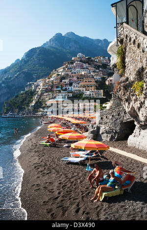 Tourists on the beach, Amalfi, Province Of Salerno, Gulf Of Salerno, Tyrrhenian Sea, Campania, Italy Stock Photo