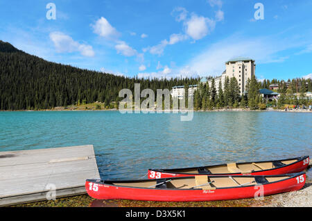 Canoes in front of The Fairmont Chateau Lake Louise in Banff National Park Alberta Canada Stock Photo