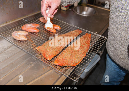 Salmon and cod roe being prepared to be smoked at a smoke house in the Uk Stock Photo