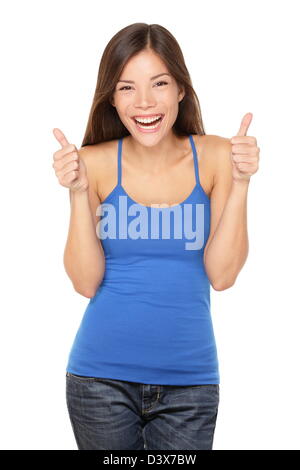 Happy young multiracial Asian / Caucasian woman in tank top giving thumbs up success sign isolated on white background Stock Photo