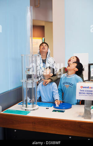 Family enjoying H2O interactive exhibit at Questacon. Canberra, Australian Capital Territory (ACT), Australia