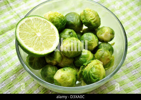 Fresh Cooked Brussel Sprouts in a Bowl with Lime Stock Photo