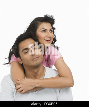 Couple day dreaming and smiling Stock Photo