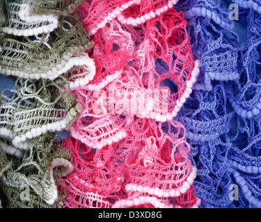 Display with colorful crochet scarves at market in Turkey Stock Photo