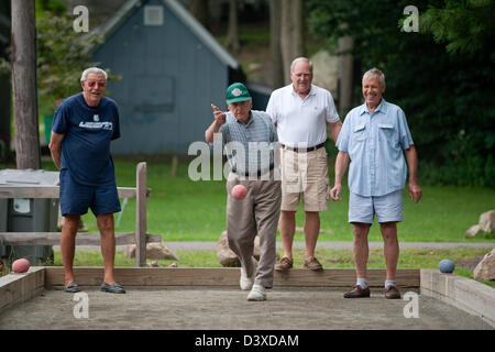 Seniors play bocce in Branford CT USA in the summer Stock Photo