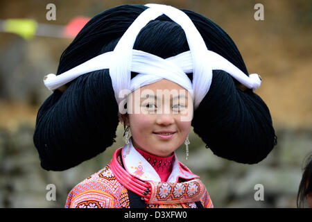 A Long Horn Miao teenage girl at the Tiao Hua festival in Guizhou. Stock Photo