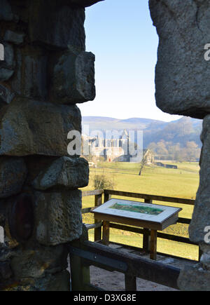 Bolton Priory seen from the Hole in the Wall in Bolton Abbey on The Dales Way  Long Distance Footpath Wharfedale Yorkshire Stock Photo