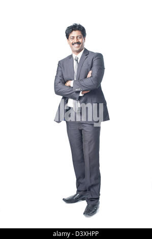 South Indian businessman standing with his arms crossed Stock Photo - Alamy