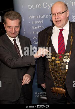 EU Commissioner Guenther Oettinger (CDU-L) appoints Federal Minister for the Environment Peter Altmaier (CDU) as the new cabbage king of Oldenburg in Berlin, Germany, 25 February 2013. The appointment took place in the context of the 56th 'Defftig Ollnburger Gröönkohl-Äten' ('Hearty Oldenburg Green Cabbage Eating'). Photo: Jörg Carstensen Stock Photo
